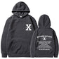 Loose hoodie in dark gray with hood, front pouch pocket, and chest/back graphic print.
