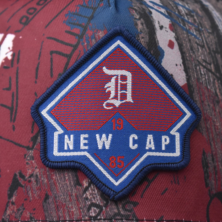Embroidered New Cap logo patch on graffiti baseball cap front panel