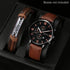 Quartz watch with brown leather strap and engraved tag bracelet accessory with Roman numerals