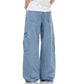Light blue denim workwear jeans with wide legs and cargo pockets at the sides