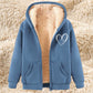 Thermal zip-up hoodie with hood, light blue exterior, sherpa lining, front pockets, heart graphic