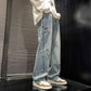 Light blue denim straight-leg pants with star appliques and distressed patches