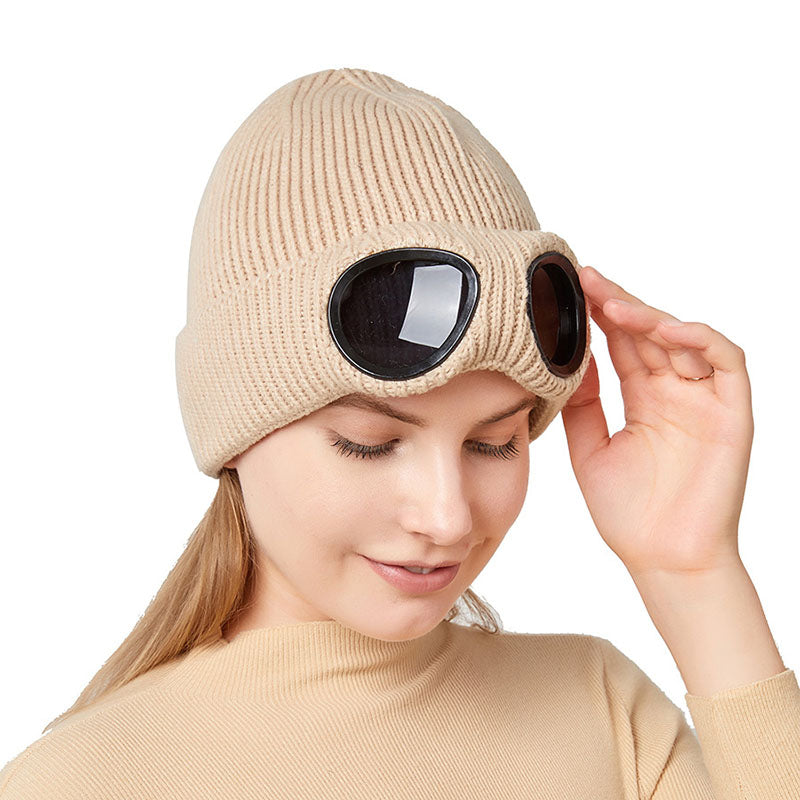 Light beige knitted beanie with windproof eye shields, side view