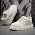 Off-white lace-up chunky-sole sneakers, side view, visible laces and thick tread sole
