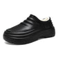 Black closed-toe chef clog shoe with fleece lining at collar and rugged rubber outsole