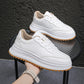 White lace-up sporty casual shoes with thick sole and tan interior lining