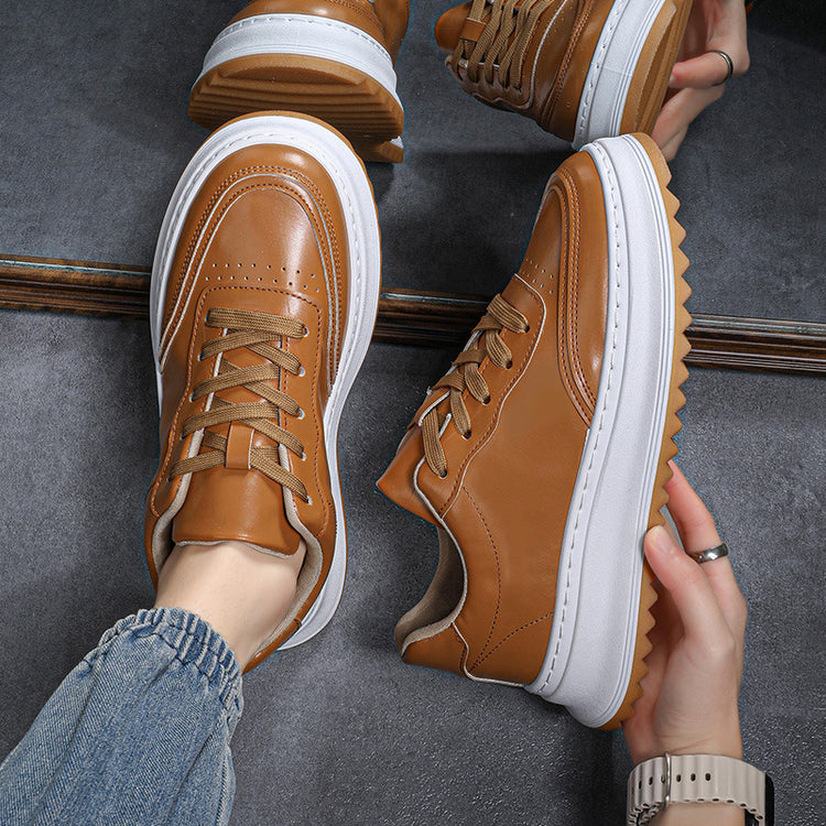 Brown lace-up sneakers with thick white sole and gum outsole