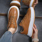 Brown lace-up sneakers with thick white sole and gum outsole