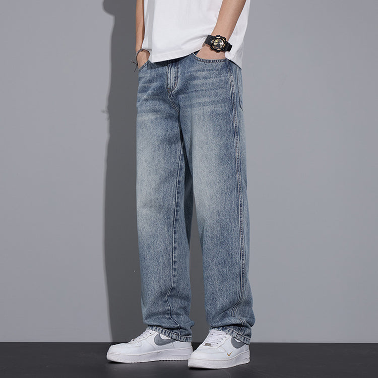 Light blue straight jeans with worn texture and straight leg from waist to cuff