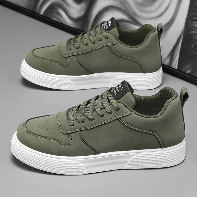 Olive green sneakers with white sole and lace-up closure