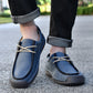 Dark blue lace-up casual shoes with cream laces and cushioned stitched upper.