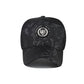 Baseball cap in black with textured pattern and round logo patch, curved brim