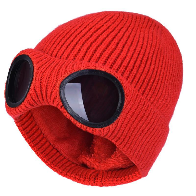 Red knitted beanie with windproof eye shields, close-up