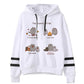 White fleece hoodie with seasonal cat prints, black drawstrings, and striped sleeve cuffs
