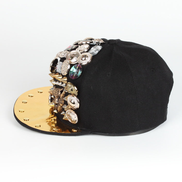 Black baseball cap with gold brim, multicolor rhinestone charms and spike studs