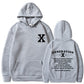 Heather gray loose pullover hoodie with hood and kangaroo pocket, front logo and back graphic.