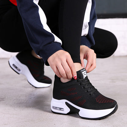 Black knit mesh lace-up sneakers with red speckle detail and white air-cushion sole