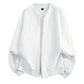 White textured bomber-style coat with full-length zipper and ribbed trim
