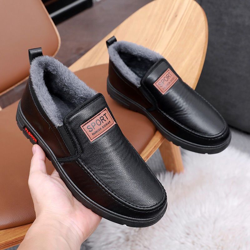 Fleece-lined waterproof slip-on shoes, black leather pair with thick rubber sole