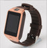 Rose gold smart watch with dark rubber strap and touch screen display