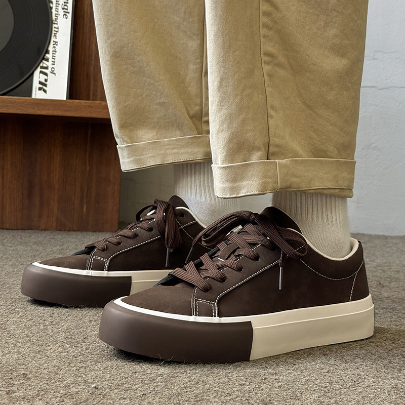 Khaki-brown low-top sneakers with lace-up front, white sole, and contrast side seams