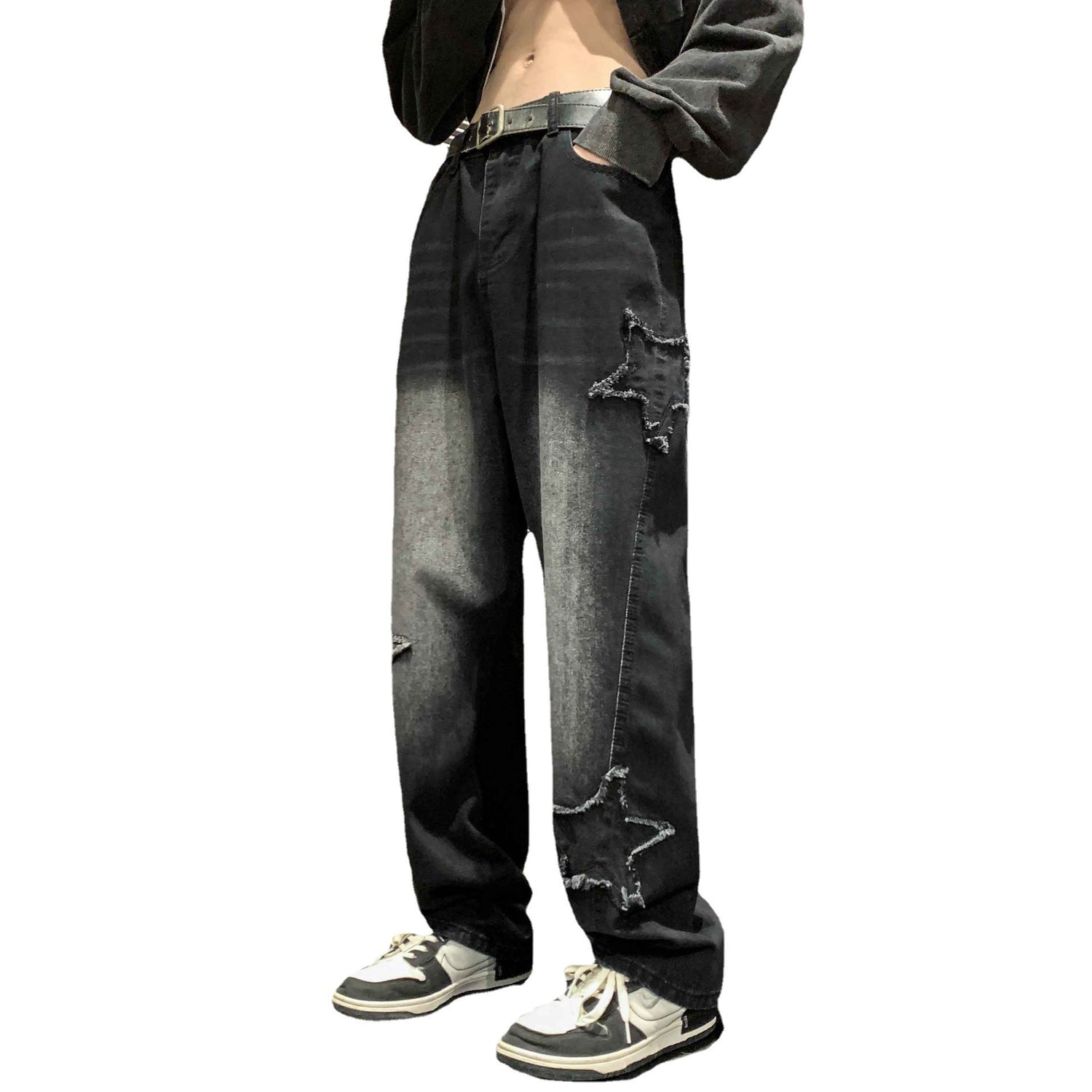 Black denim straight-leg pants with star-shaped distressed appliques