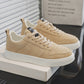 Beige sneakers with white sole, lace-up front, shown on a box