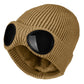 Tan knitted beanie with windproof eye shields
