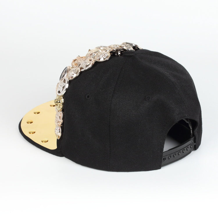 Black baseball cap back view with gold underside brim and rhinestone side trim