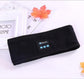 Black Bluetooth headband with rectangular control panel and button icons