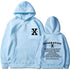 Loose hoodie in light blue with hood, front pouch pocket, and chest/back graphic print.